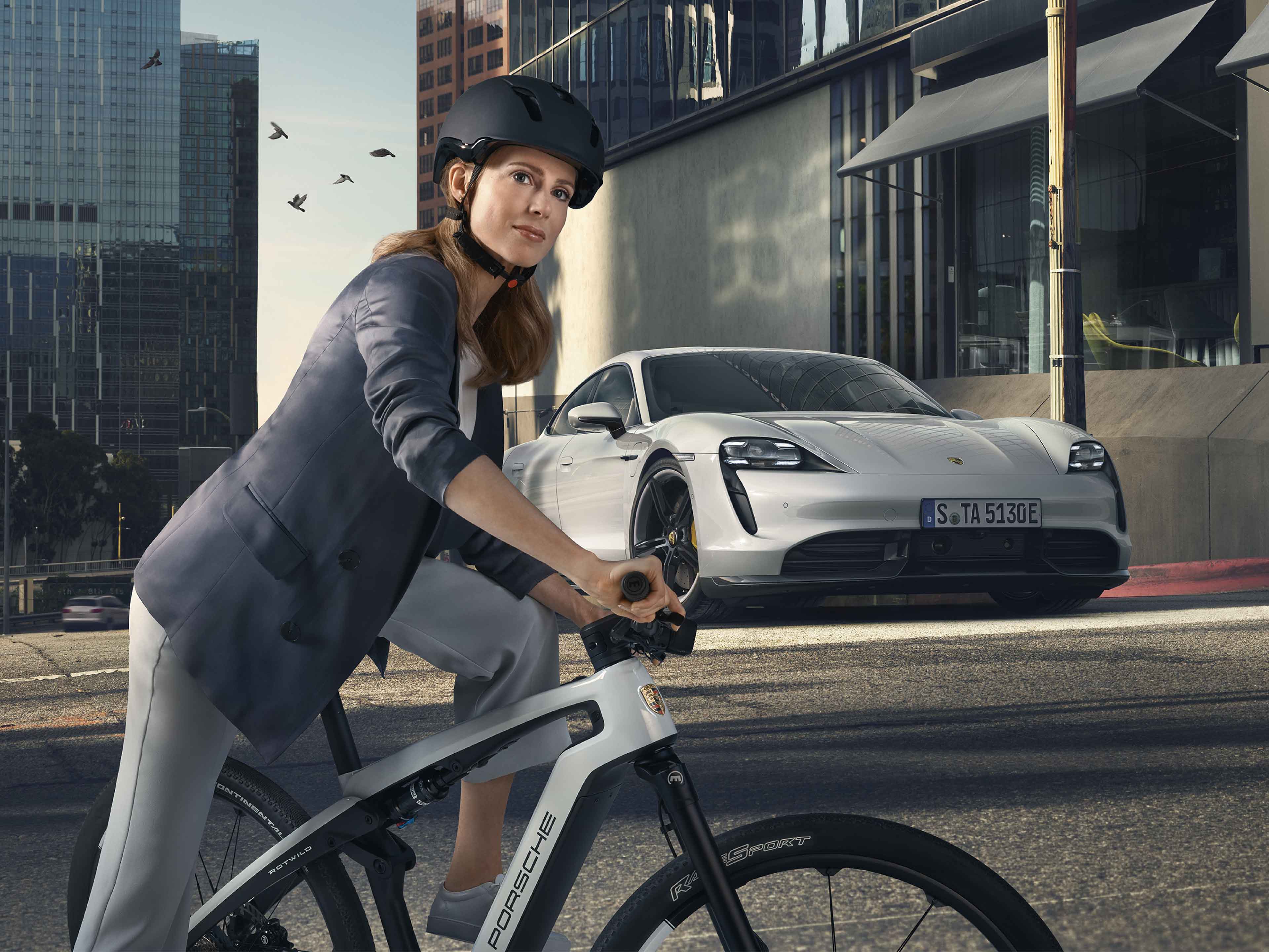 woman riding porsche ebike in the city