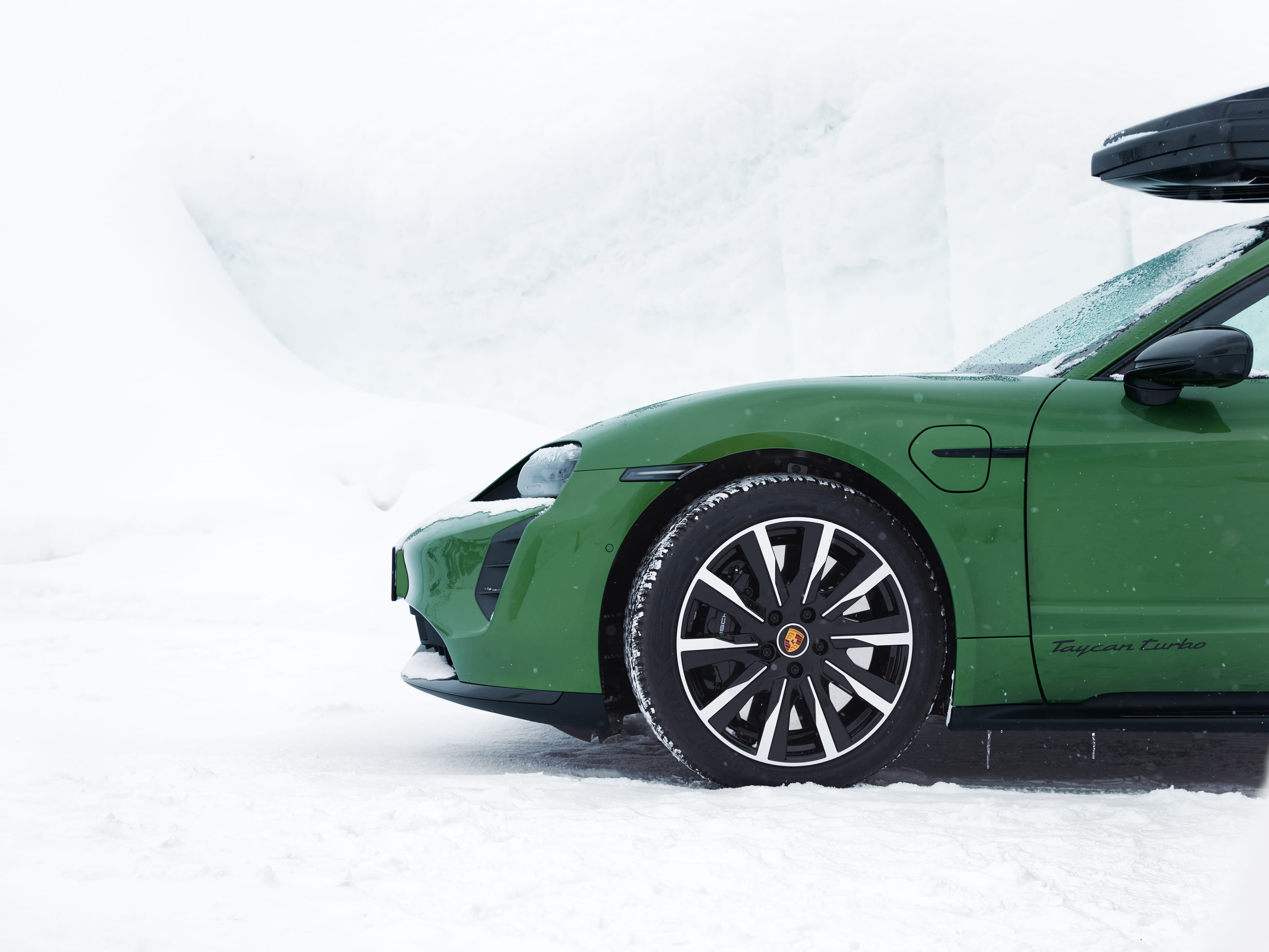 Green Taycan Turbo with winter wheels